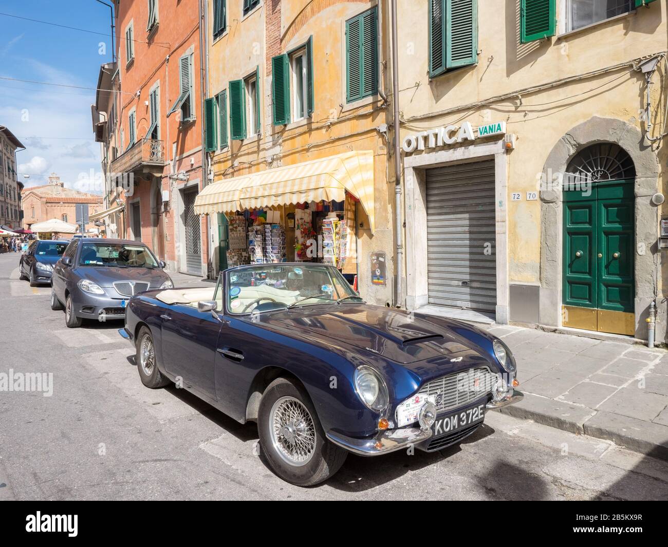 Vintage car from Aston Martin parked on a vintage street in Pisa, Tuscany, Italy Stock Photo