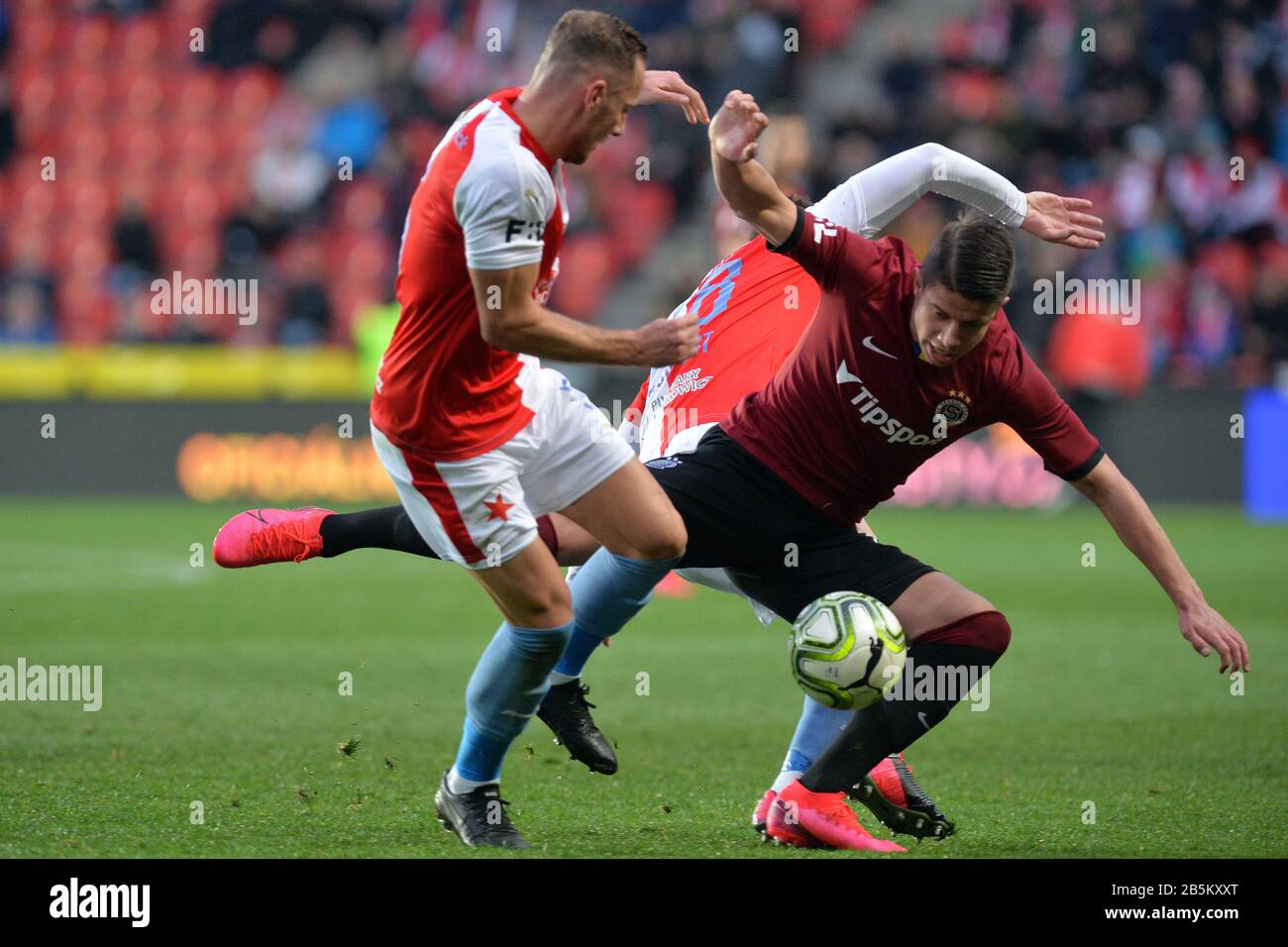 Prague, Czech Republic. 14th Apr, 2019. L-R Simon Deli (Slavia) and  Benjamin Tetteh (Sparta) are seen during the Czech first soccer league  (Fortuna Liga), 28th round, match SK Slavia Praha vs AC