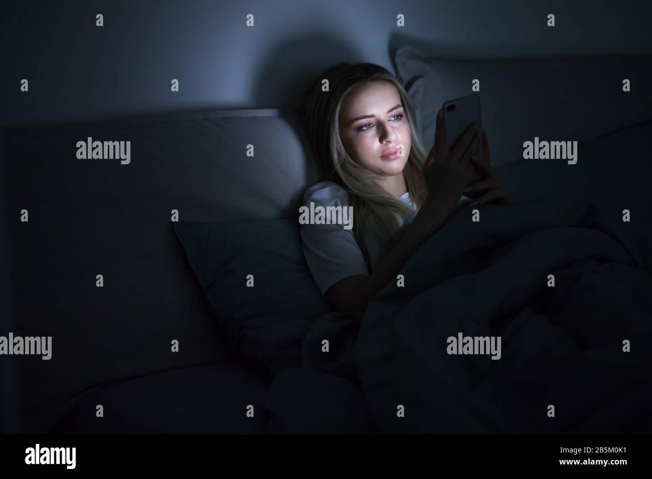 Image showcasing Social network addiction, nomophobia, insomnia, sleep disorder concept ...