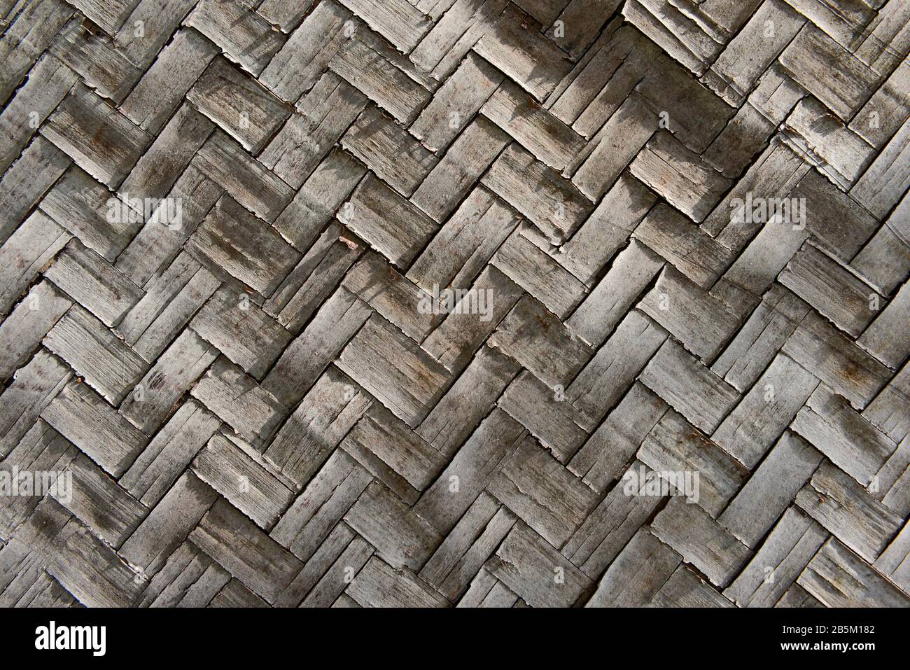 Old bamboo matboard walling at a construction site in Maizidian, Beijing, China Stock Photo