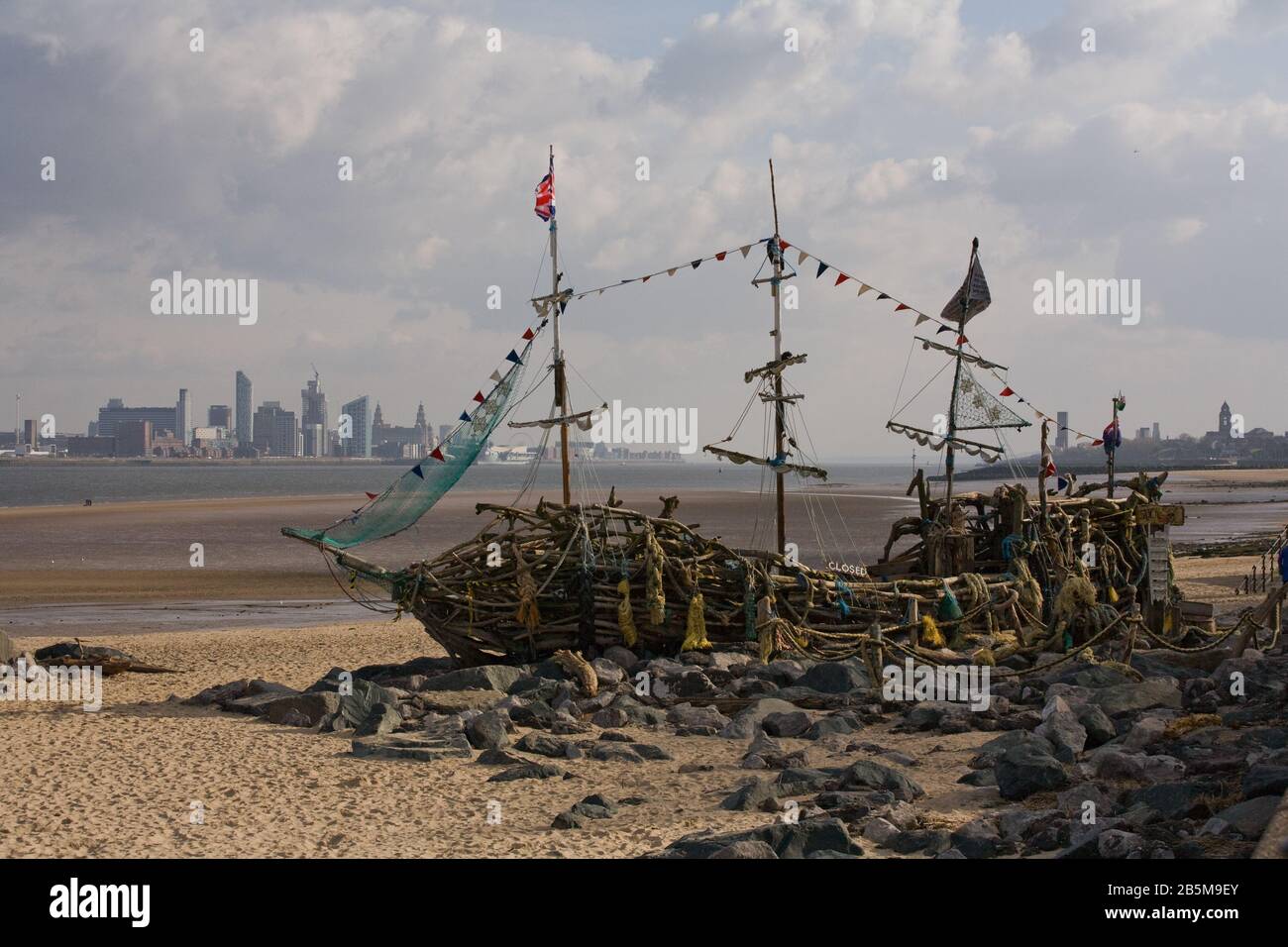 The black pearl pirate ship built from driftwood in the British seaside town of New Brighton on the banks of the River Mersey Stock Photo