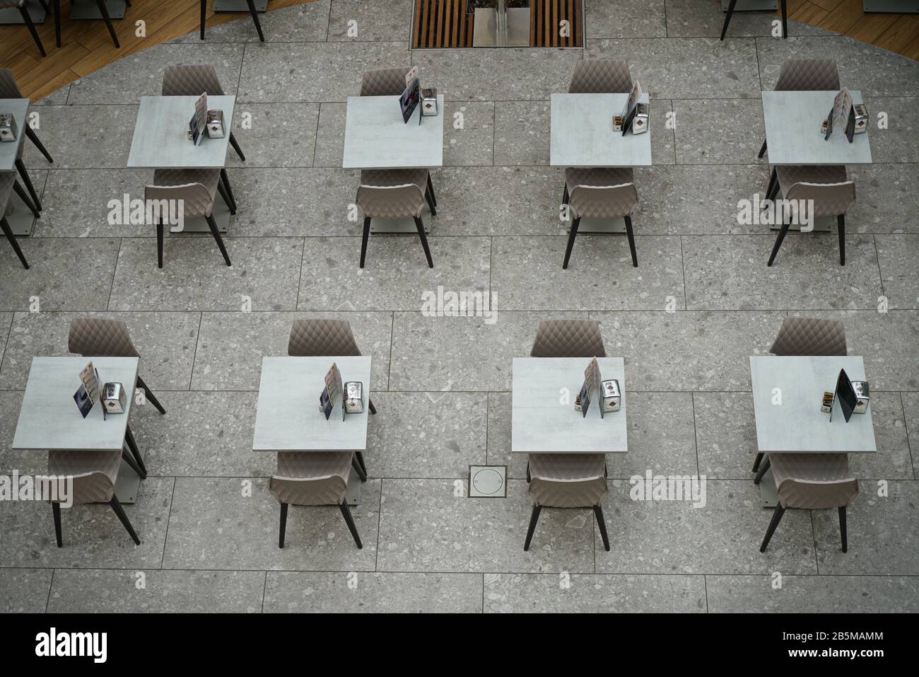 Coronavirus impact, empty restaurant and cafeteria tables.  Milan, Italy - March 2020 Stock Photo