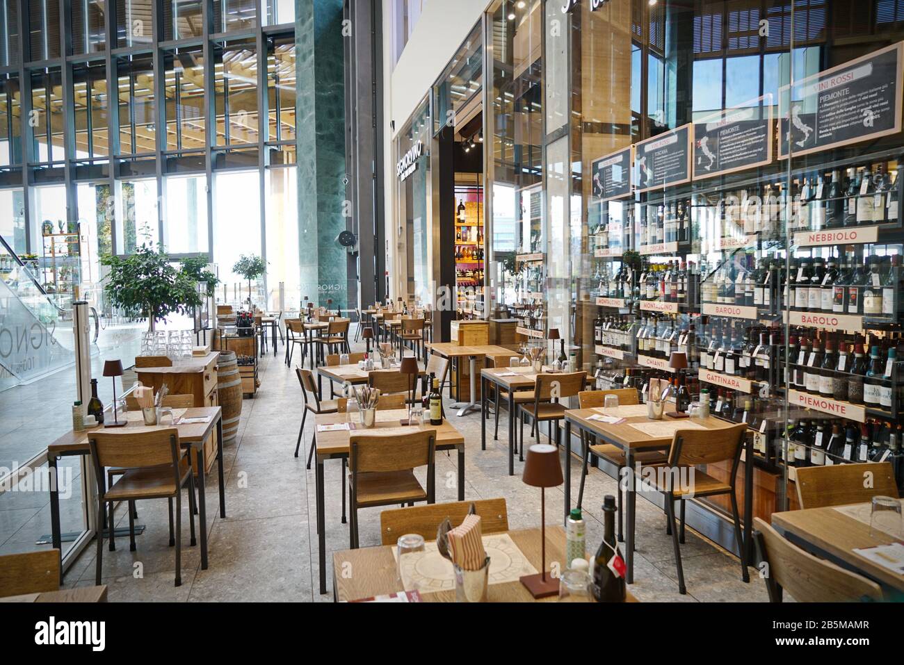 Coronavirus impact, empty restaurant and cafeteria tables.  Milan, Italy - March 2020 Stock Photo