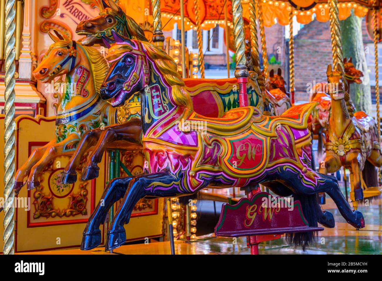 A colourful traditional style carousel with horses on the King's Square in the historic old town of York, North Yorkshire, England. Stock Photo