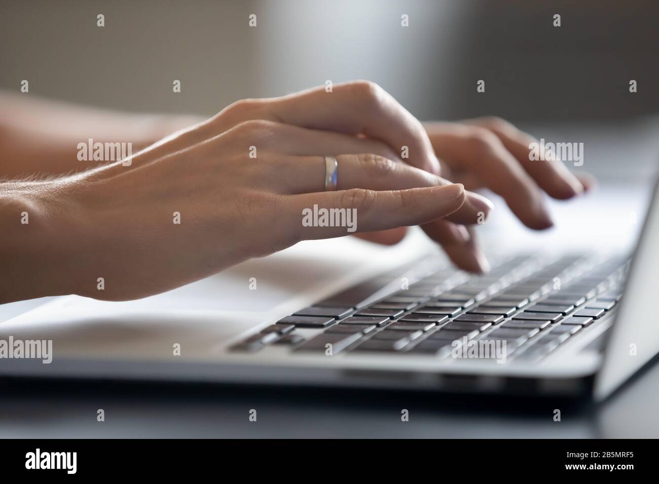 She Is Typing Message Close up young woman typing message on computer Stock Photo - Alamy