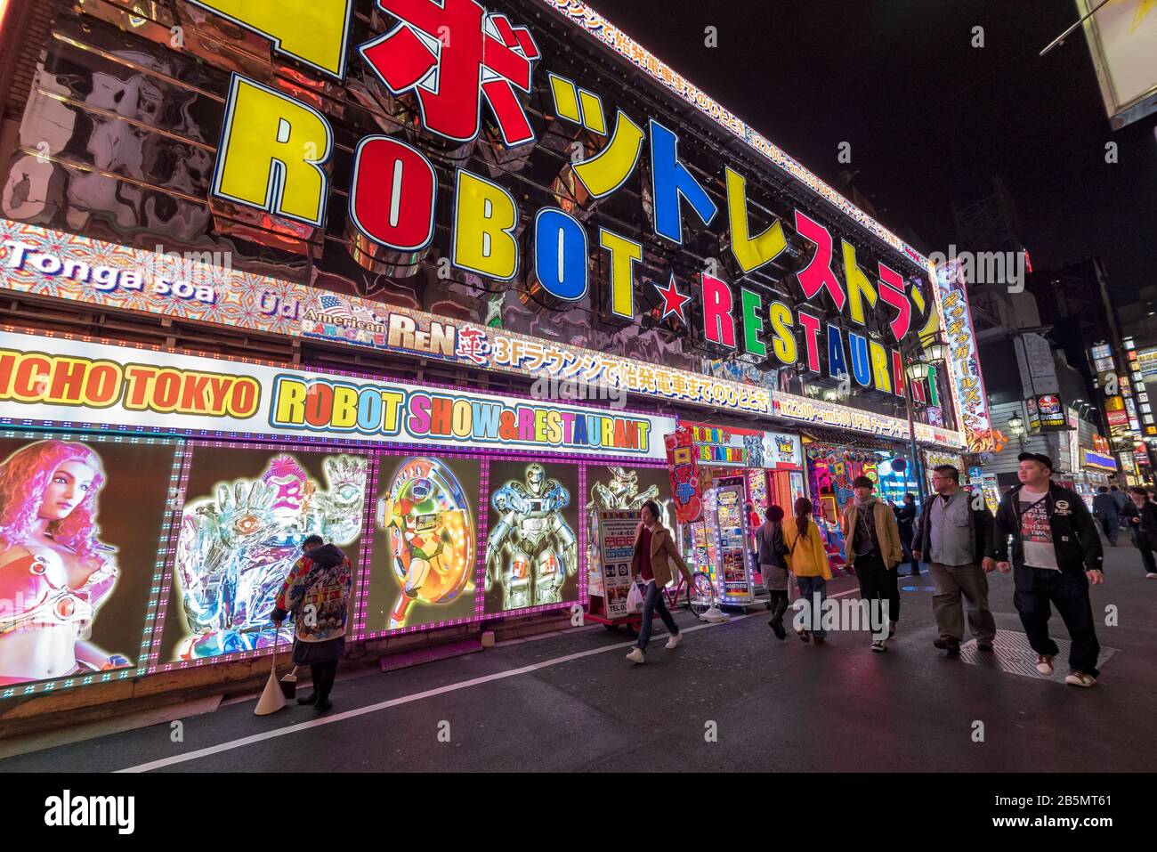 Tourists at night outside the Robot Restaurant, Kubukicho entertainment district, Shinjuku, Tokyo, Japan Stock Photo