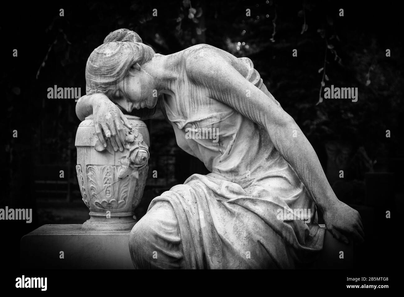 Sad and weeping woman sculpture. Sad grieving expression sculpture with