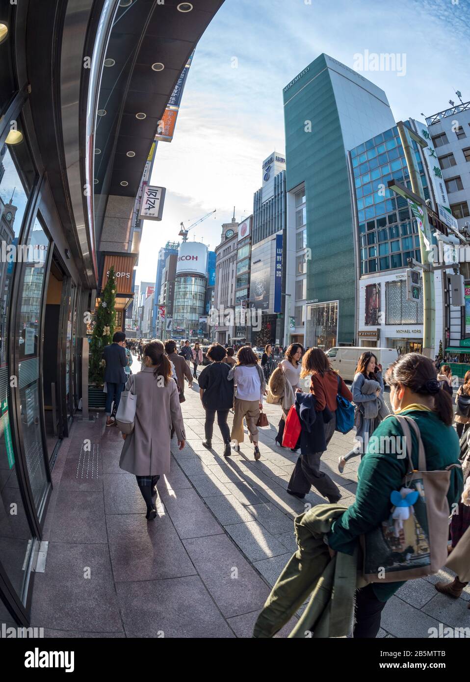 Crowded side walk, Ginza shopping district, Tokyo, Japan Stock Photo