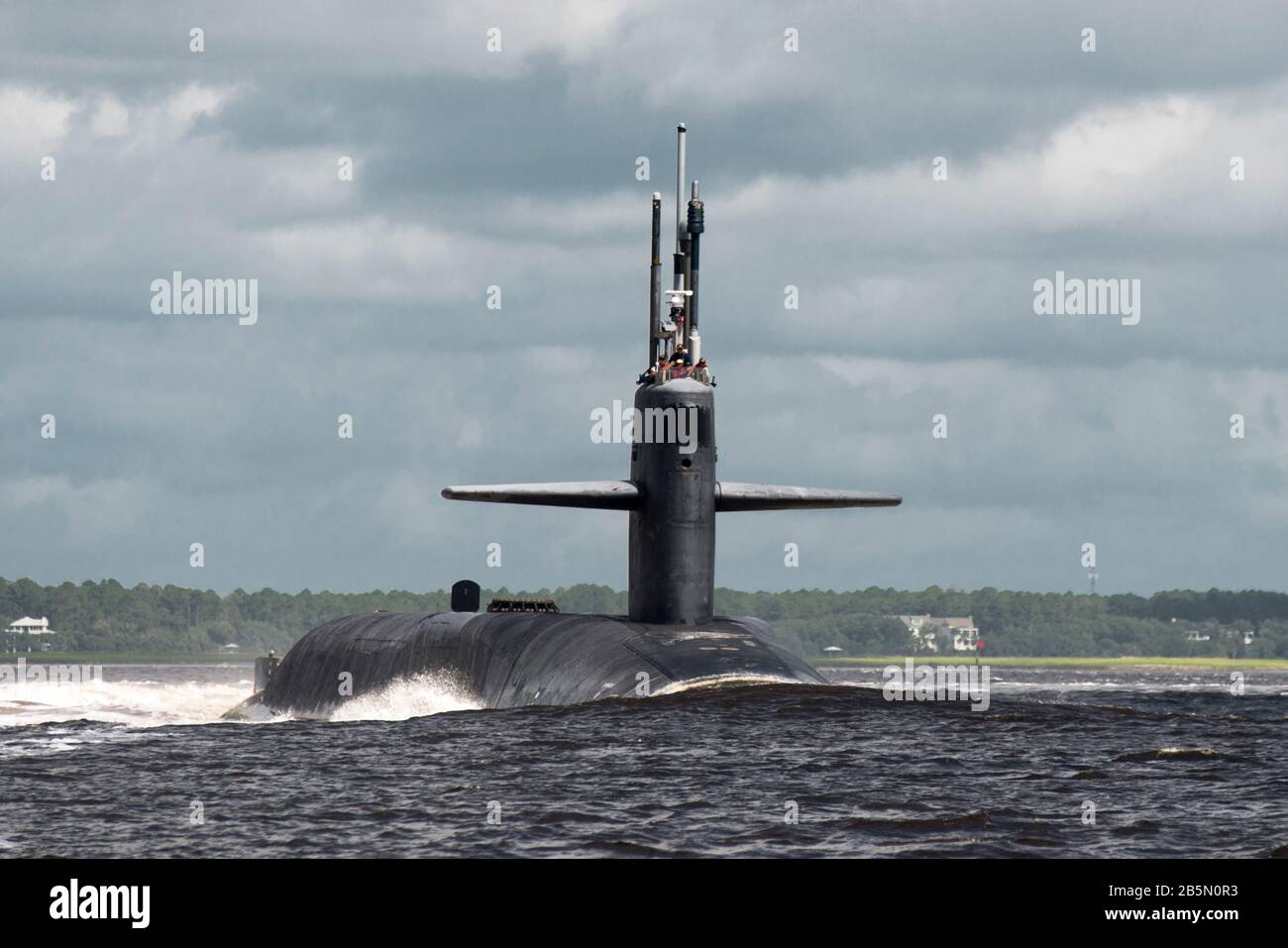 The U.S. Navy Ohio-class nuclear-powered ballistic missile USS Florida transits the Saint Marys River as it departs Naval Submarine Base Kings Bay July 3, 2013 in Kings Bay, Georgia. Stock Photo