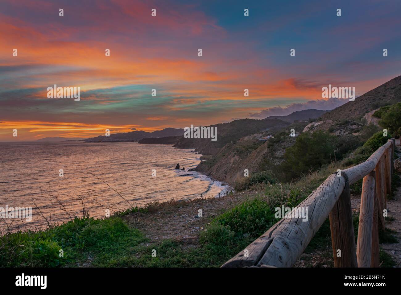 Landscape of a rocky coast with sunset colors Stock Photo