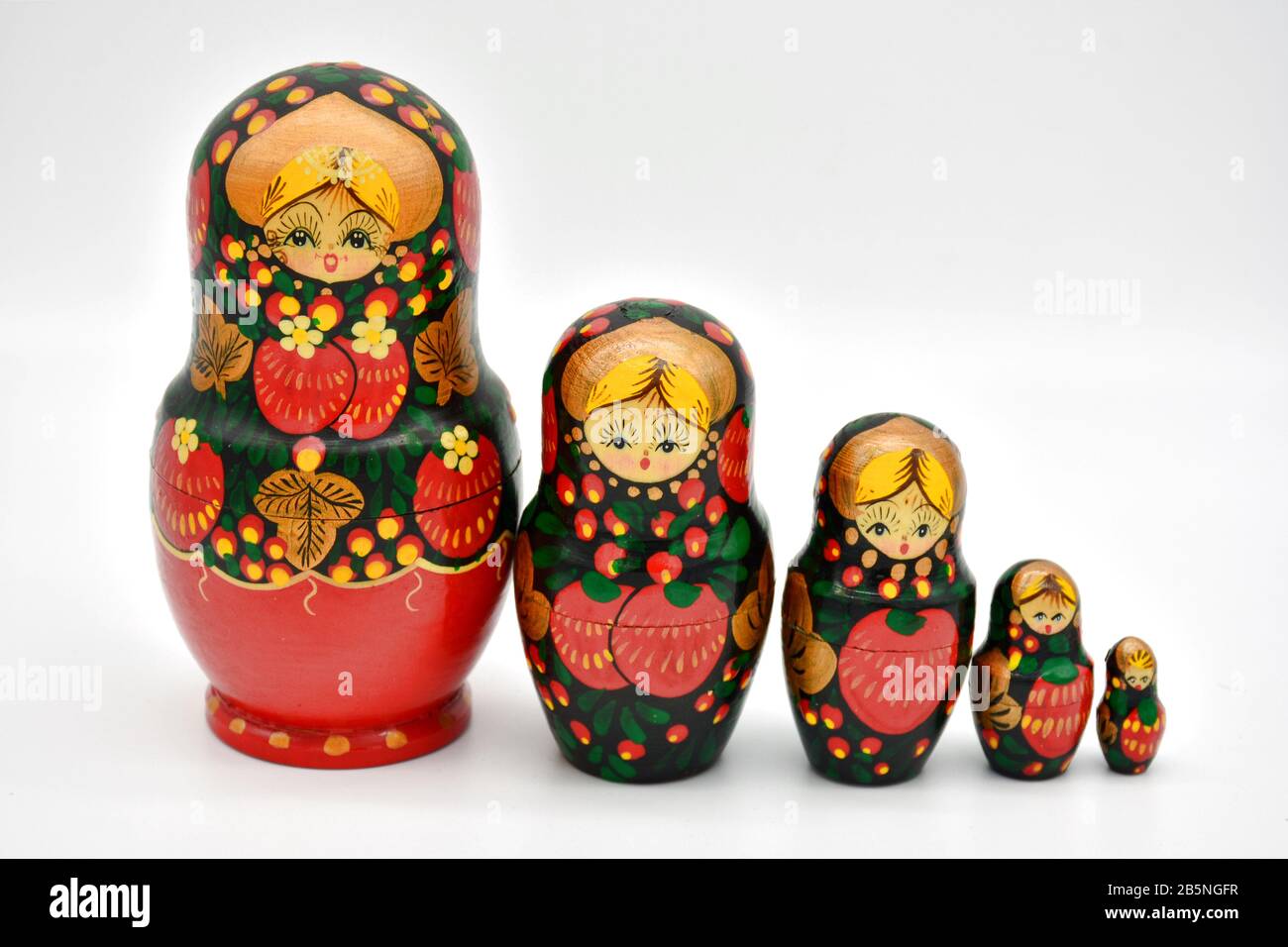 Family of matrioskas dolls, made of wood and hand painted, arranged from highest to lowest Stock Photo