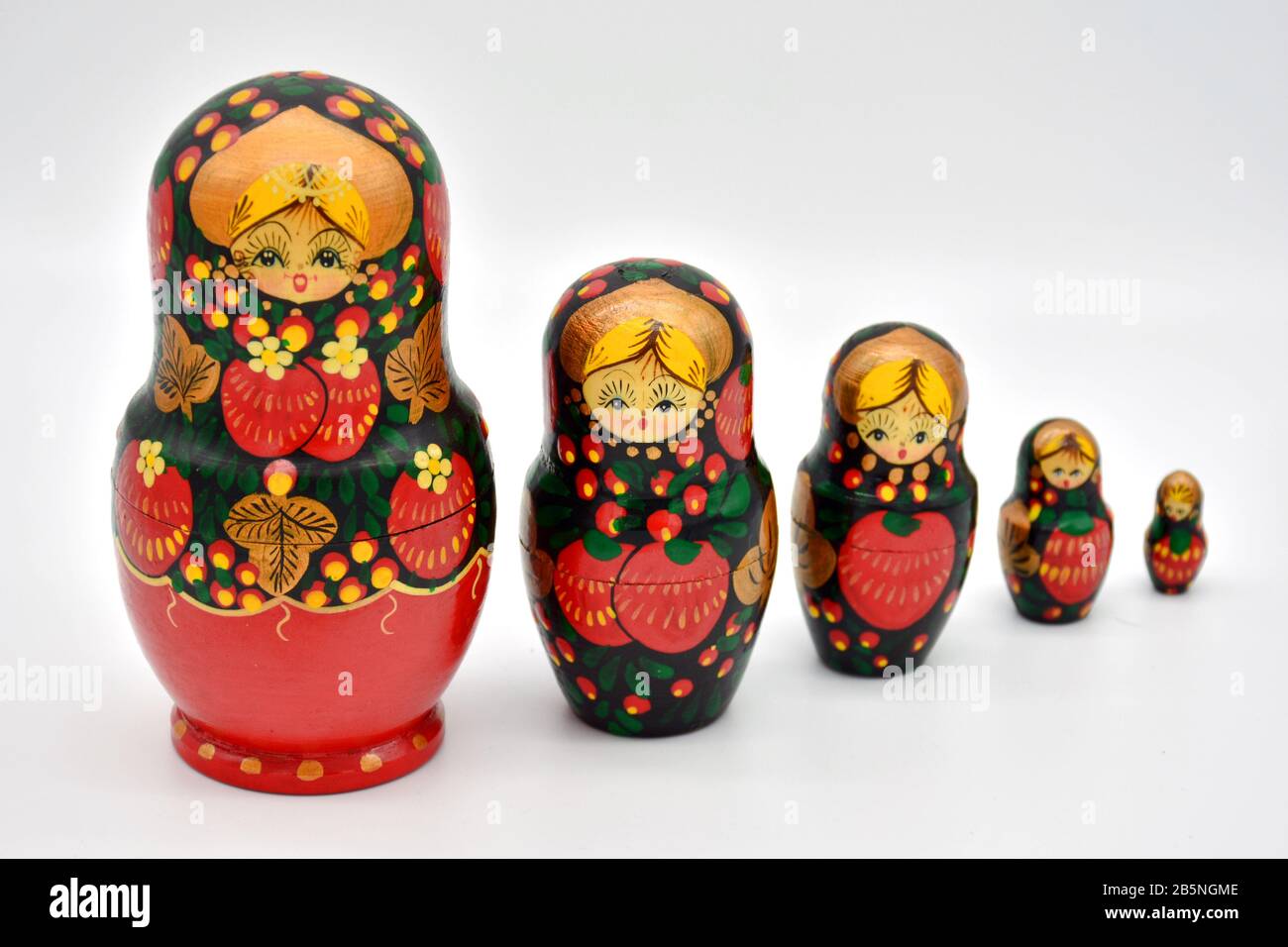 Family of matrioskas dolls, made of wood and hand painted, arranged from highest to lowest Stock Photo