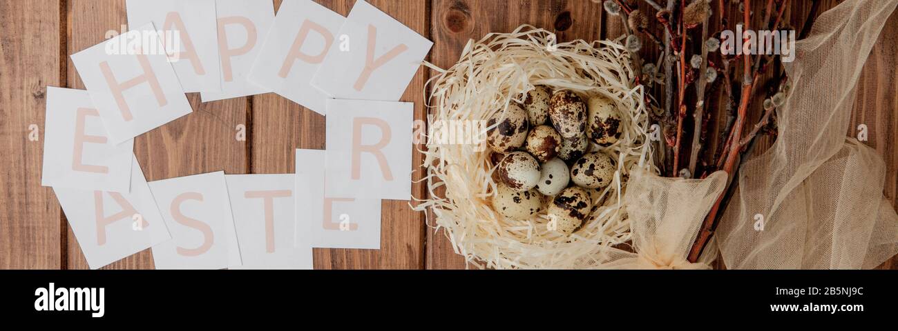 Flat lay composition of quail eggs and card with text Happy Easter on ...