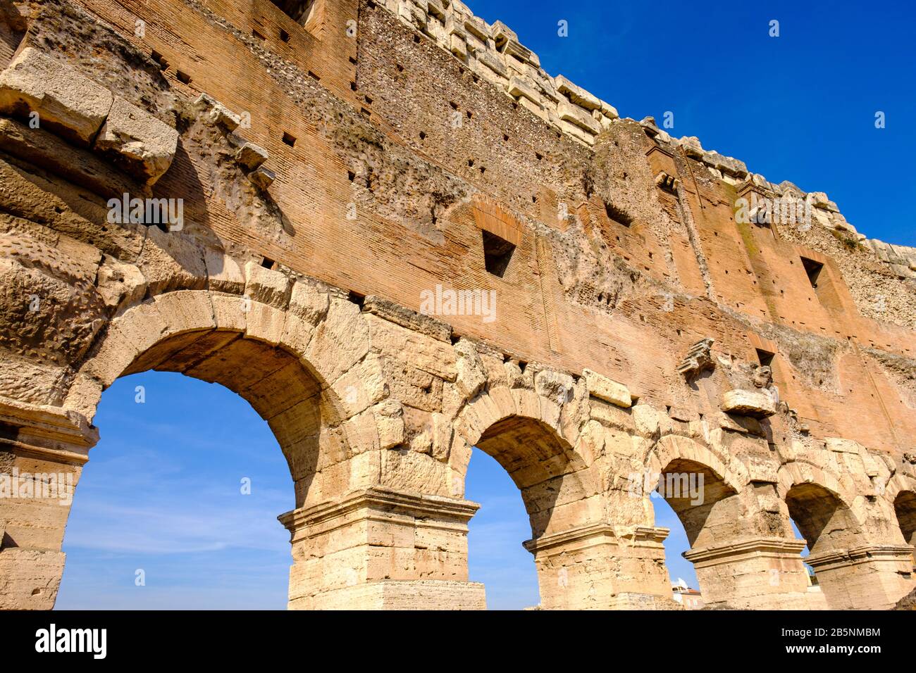 Inside view, details of the Colosseum upper-level arches and columns, Coliseum architecture brickwork, Flavian Amphitheatre, Roman Forum, Rome, Italy Stock Photo