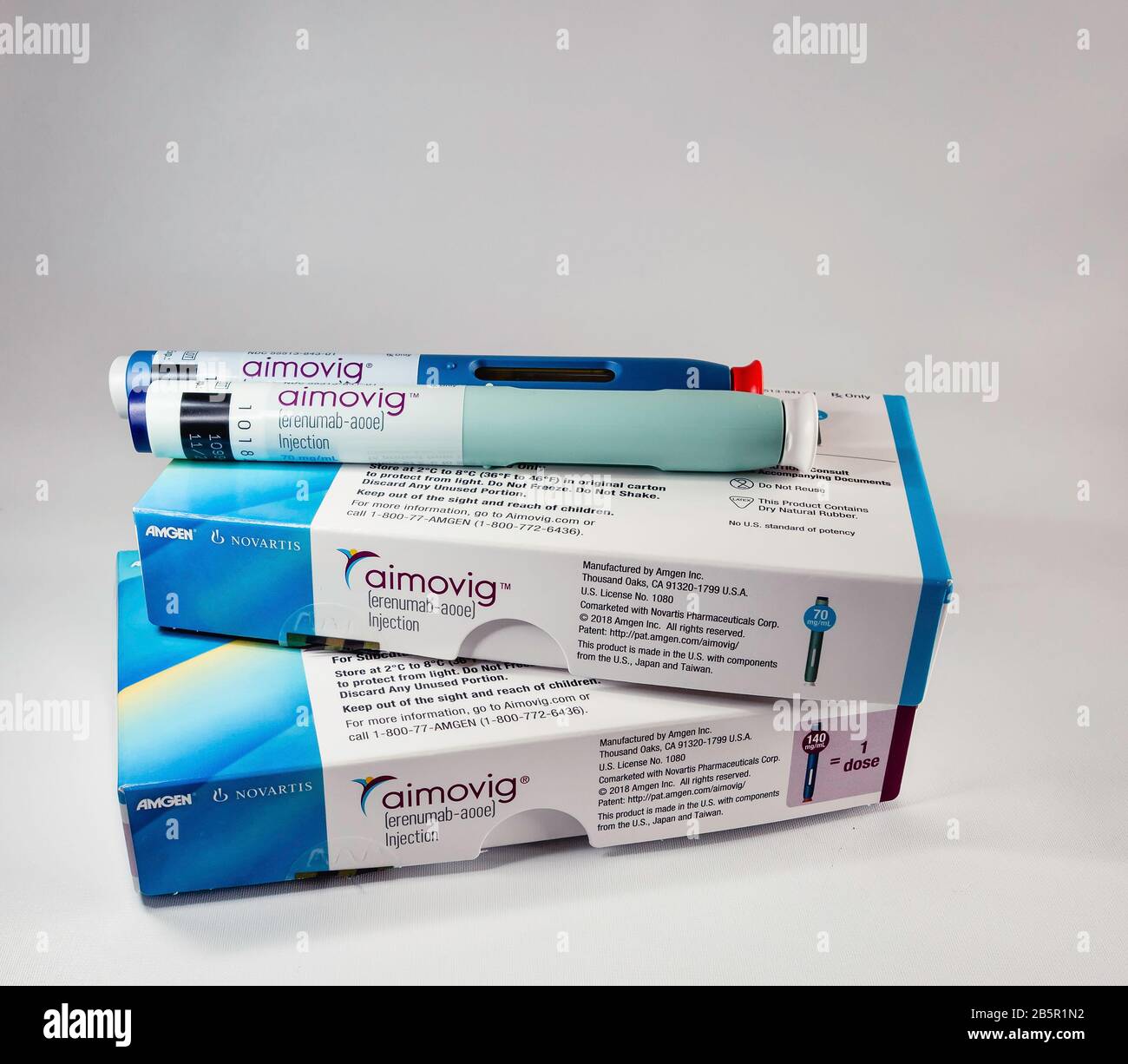 Aimovig (erenumab-aooe) 70 mg and 140 mg auto-injector devices, prescription drug for migraine prevention, and boxes, studio, color, United States Stock Photo