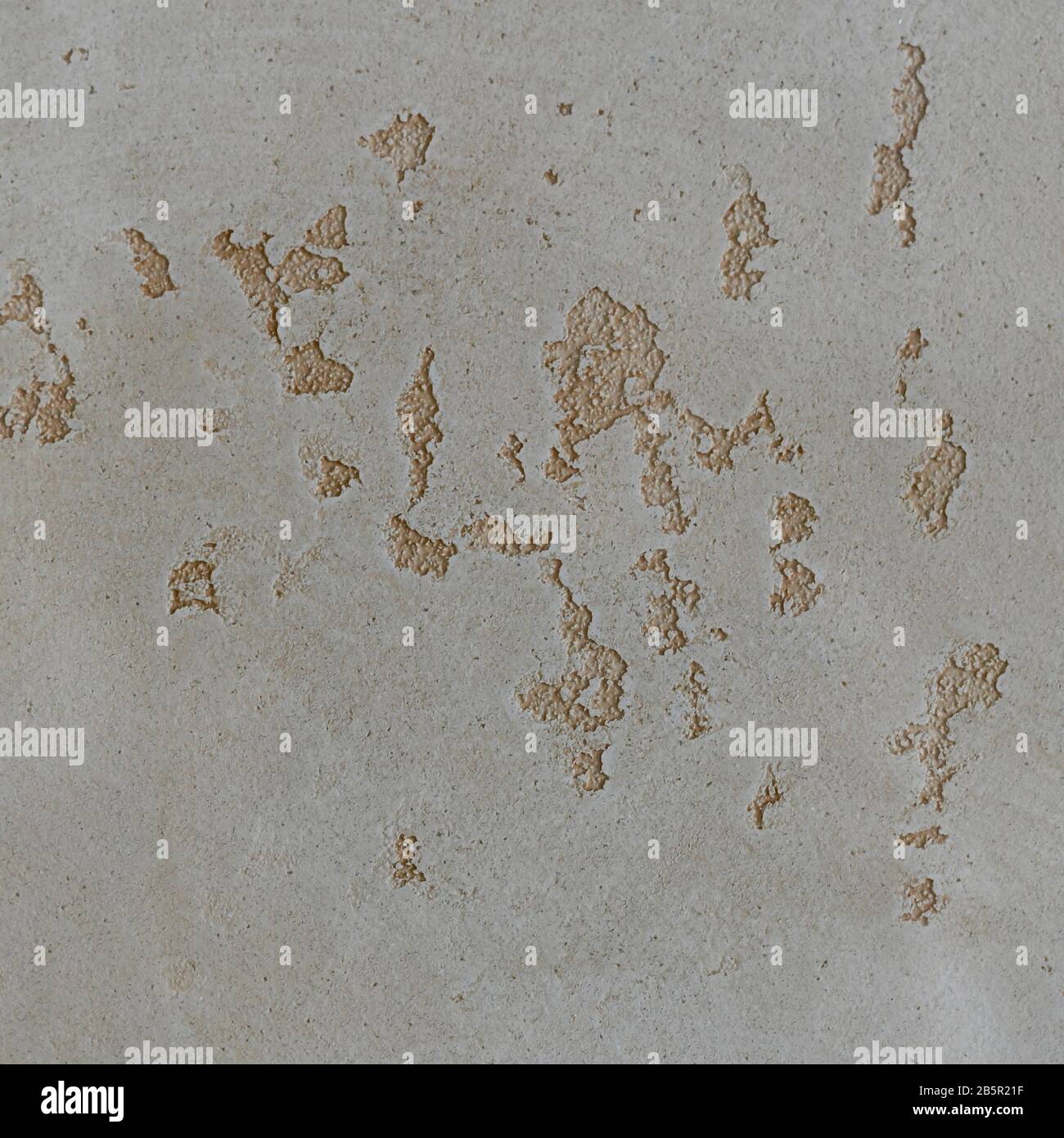 Light beige background with brown textured spots inside. Stock Photo