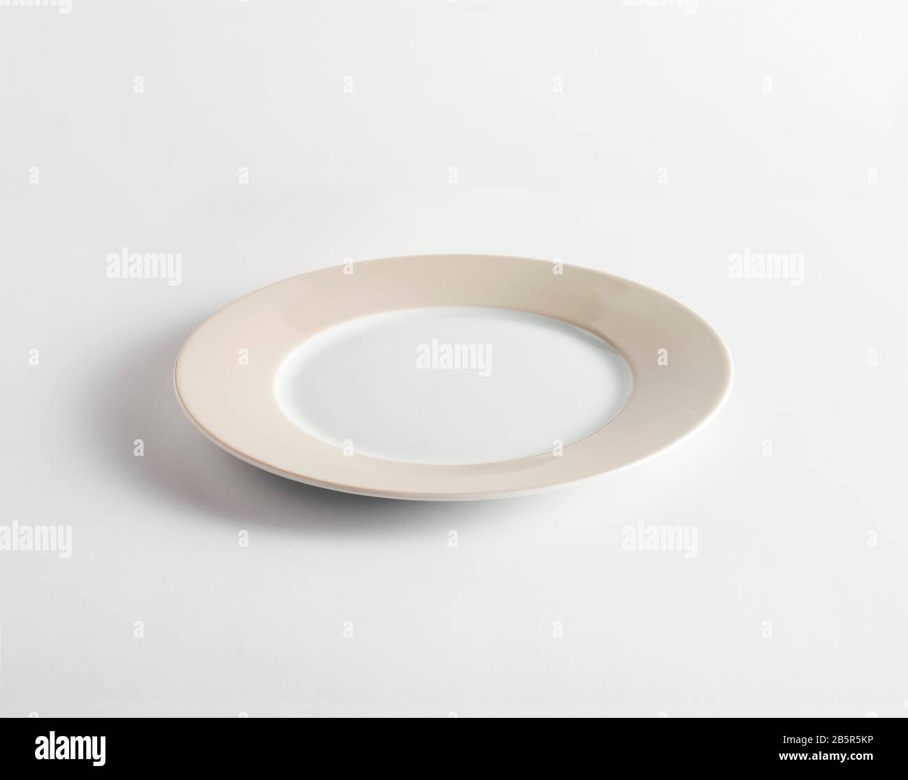 empty plate on white background Stock Photo - Alamy