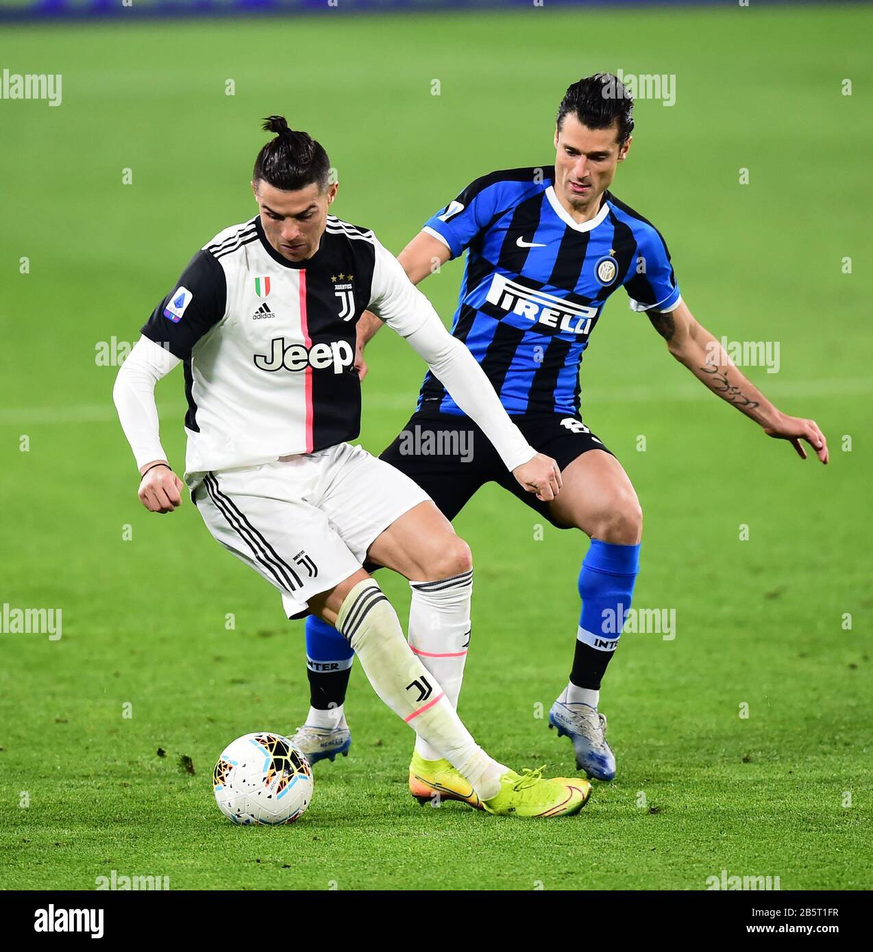 Turin, Italy. 8th Mar, 2020. Cristiano Ronaldo (L) of Juventus vies with  Antonio Candreva of Inter Milan during the Italian Serie A soccer match  between Juventus and Inter Milan in Turin, Italy