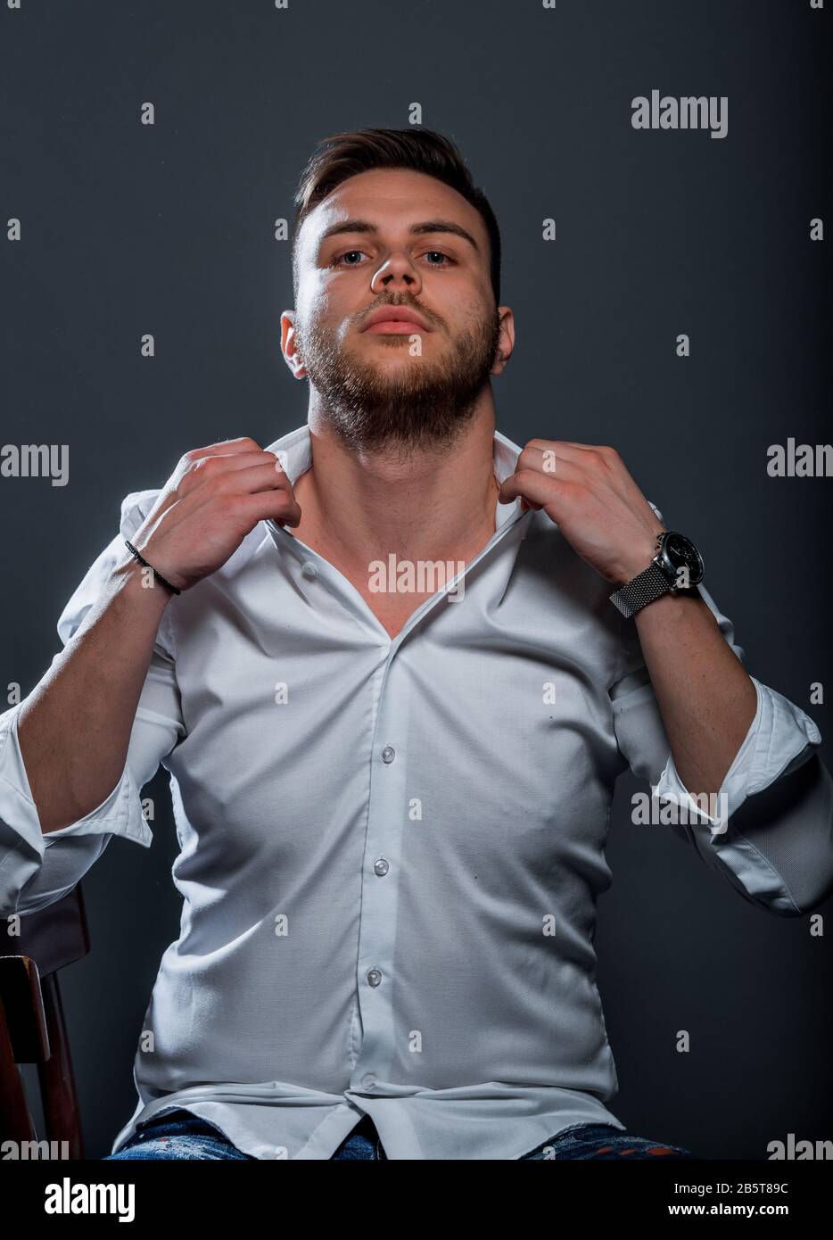 Young Men Put On Clothes Outside a Solid Color Base Shirt