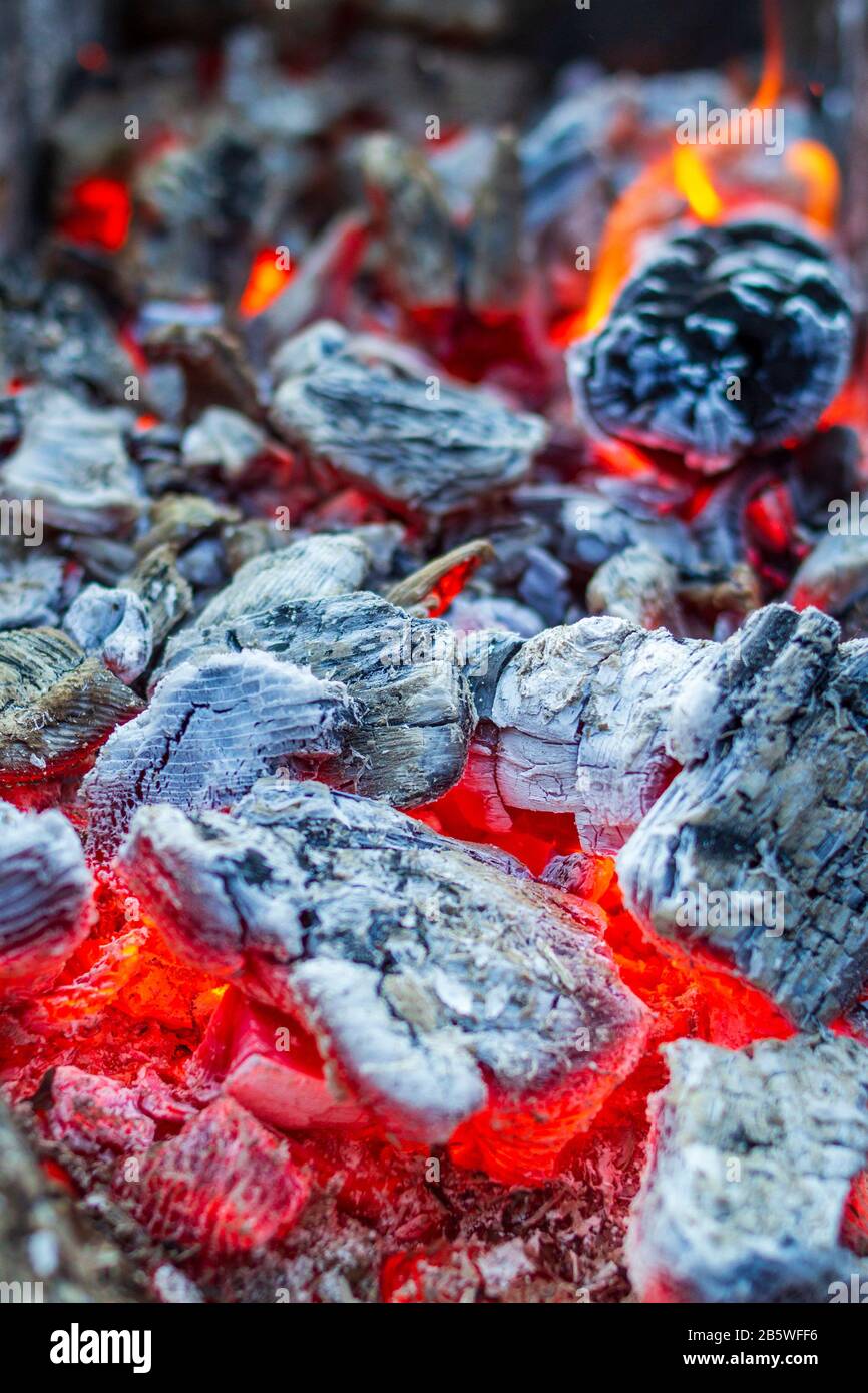 Glowing Hot Charcoal Briquettes Close-up Background Texture Stock Photo