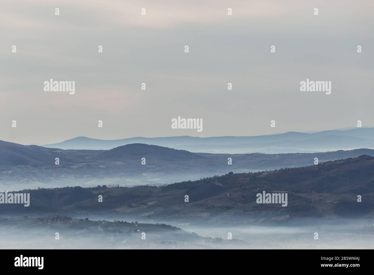 Mist Between Two Ridges Sea of fog and mist between layers of mountains and hills Stock Photo ...