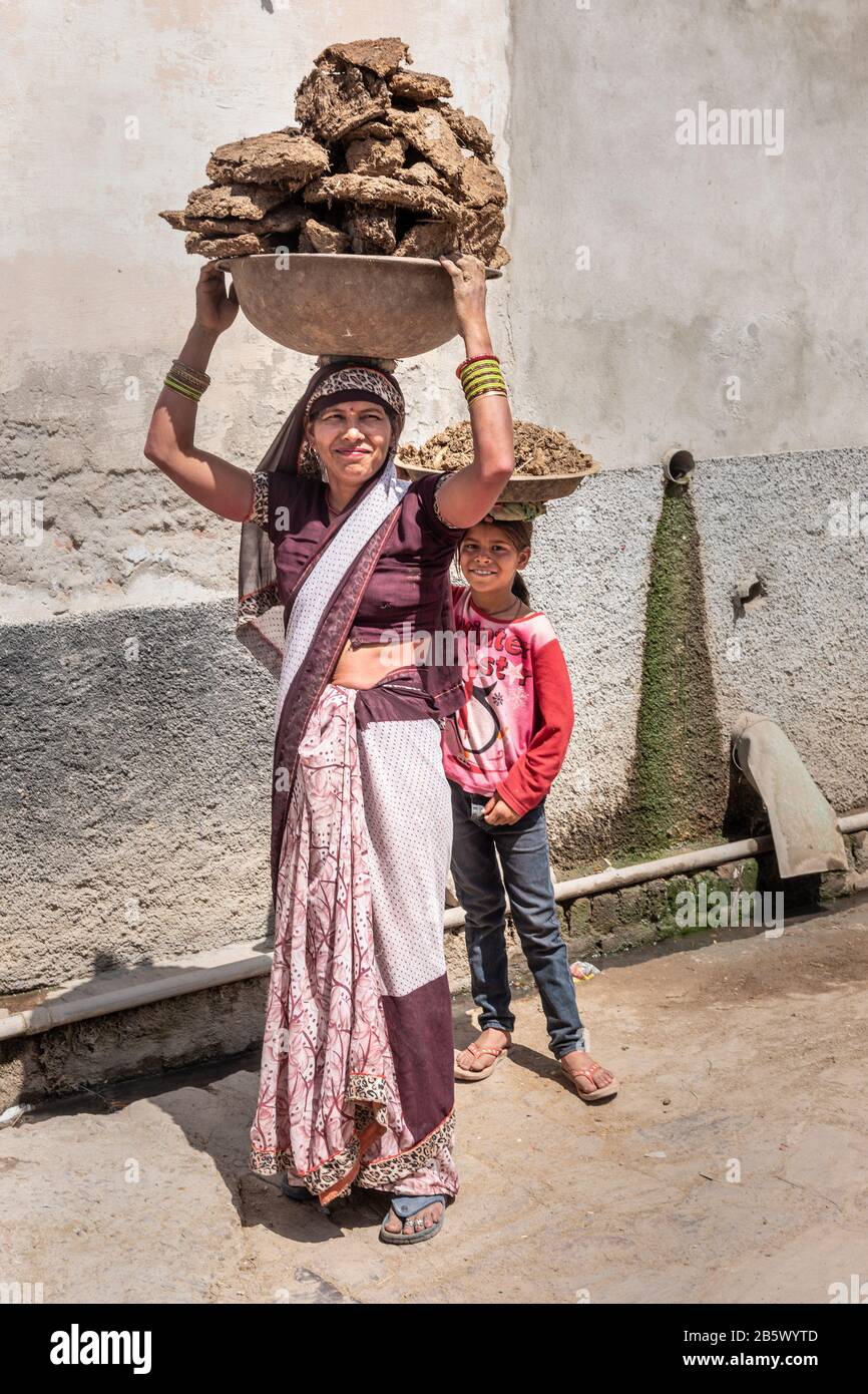 Girl with cow dung hi-res stock photography and images - Alamy