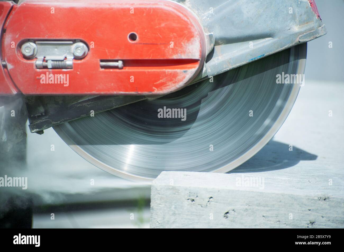 The joint cutter machine on a brushed concrete surface. Construction