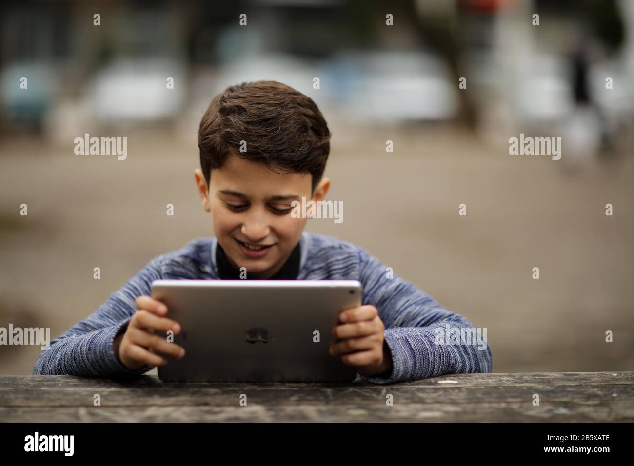 February 23, 2020: Children play with their smartphones and ipad in their  home without parental supervision in the Turkish city of Gaziantep. The  fact that many children from a young age play