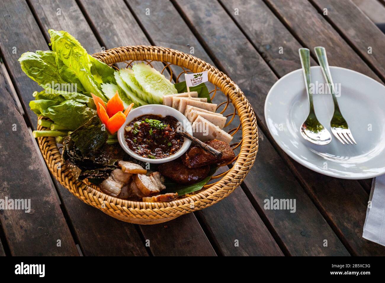 Lao starter selection at Kong View restaurant by the Mekong in Vientiane. Includes Luang Prabang sausage and riverweed Stock Photo
