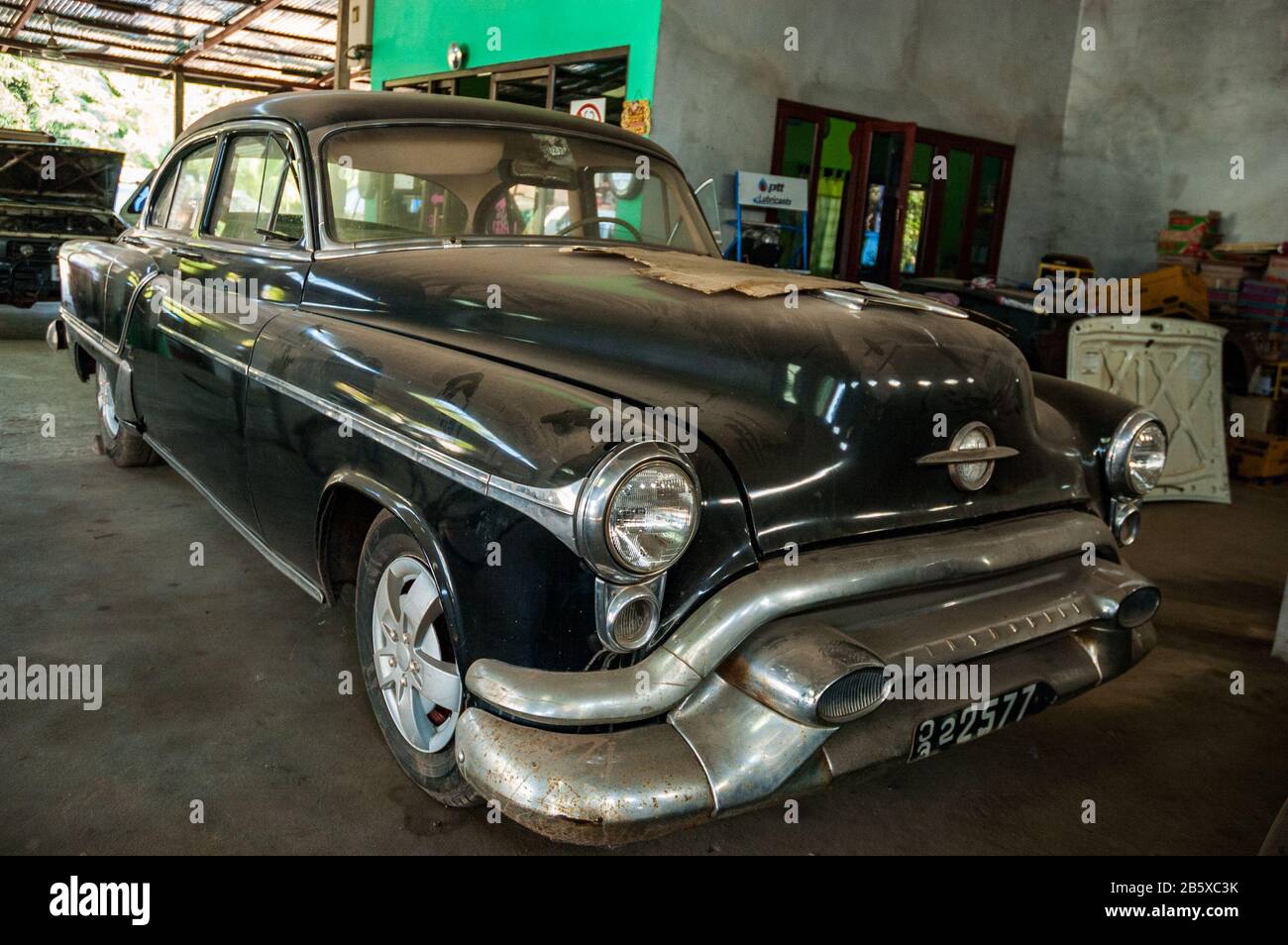 A 1952 Oldsmobile in a garage in the Laotian capital Vientiane. Stock Photo