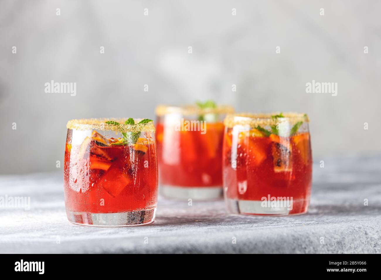 Three glasses of campari gin spritz. Cocktail of sweet, a touch of