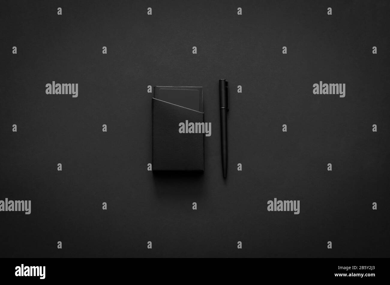 Name card box and pen in modern lifestyle on dark background for minimalist flat lay black concept. Stock Photo