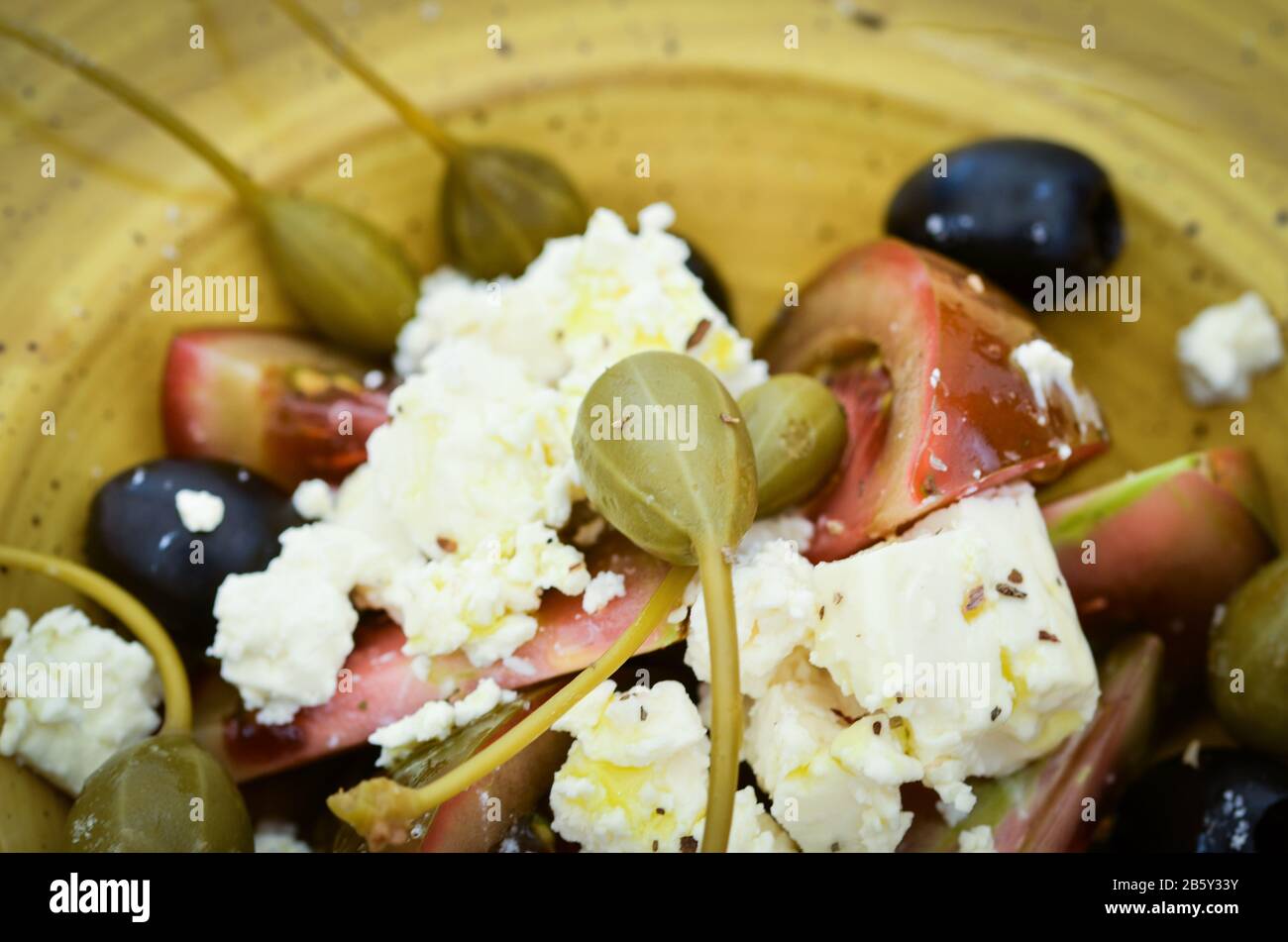 delicious greek salad with fresh vegetables & greek cheese, spread with ...