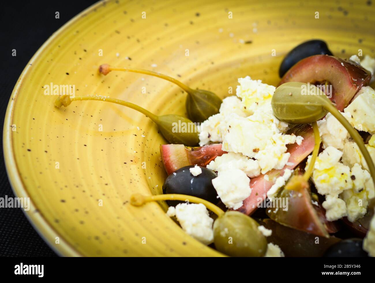 delicious greek salad with fresh vegetables & greek cheese, spread with ...