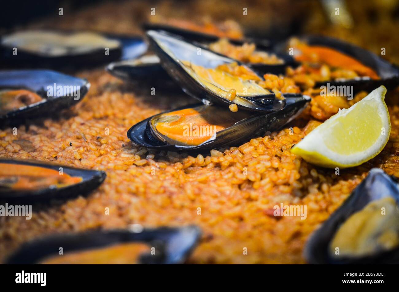 spanish paella dish with fresh seafood & vegetables Stock Photo