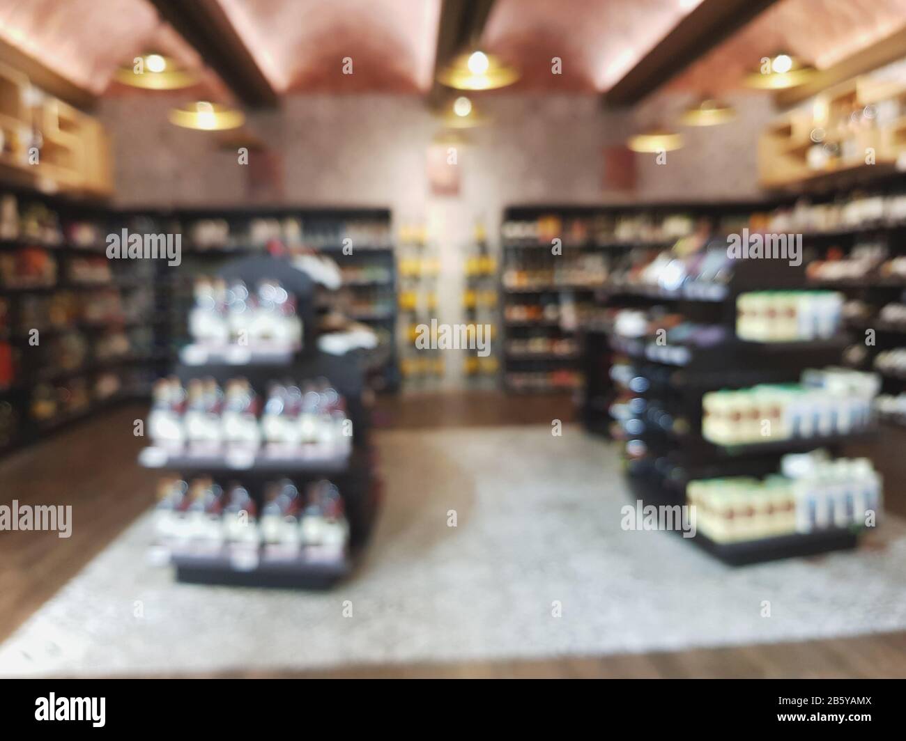 Wine blurred shelfes. Liquor mini market shop background Stock Photo