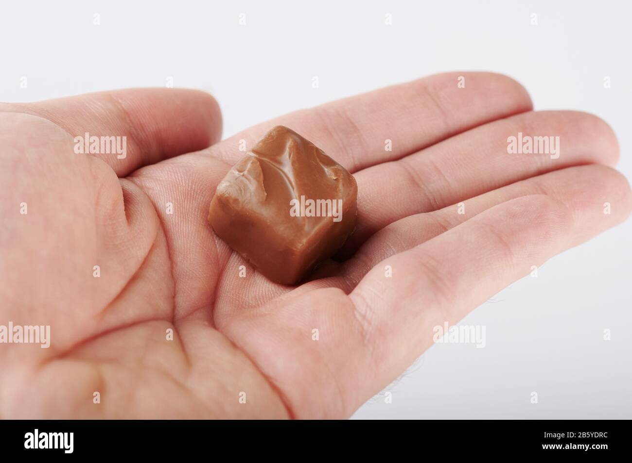 Hand chocolate bar hires stock photography and images Alamy