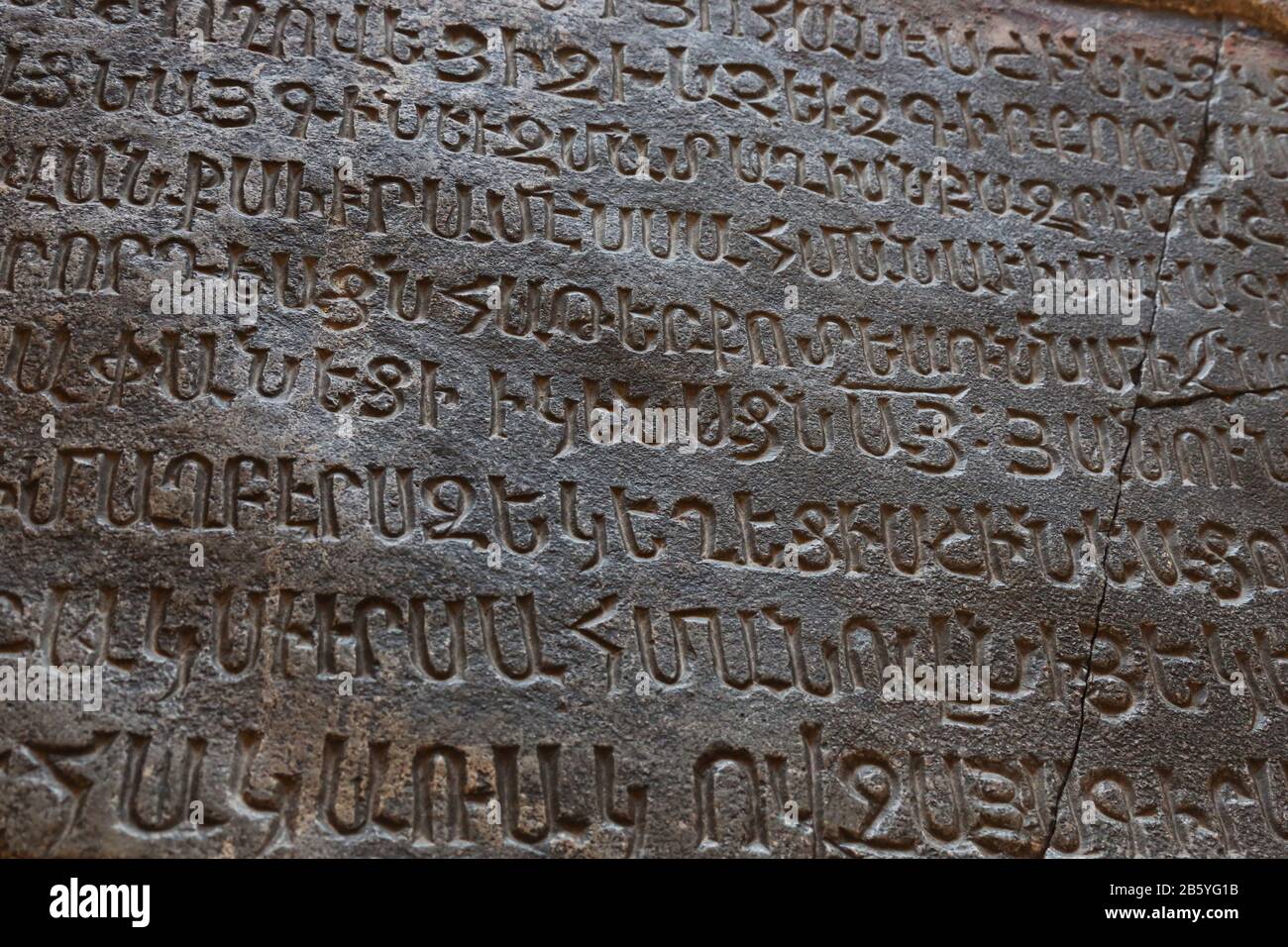 Ancient armenian plate with carved words Stock Photo