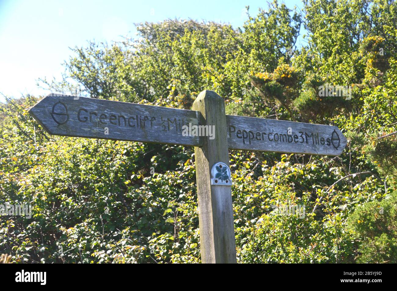 National Trust Signpost for Greencliff & Peppercombe between Westward Ho! and Buck's Mills on the South West Coast Path, North Devon. England, UK. Stock Photo