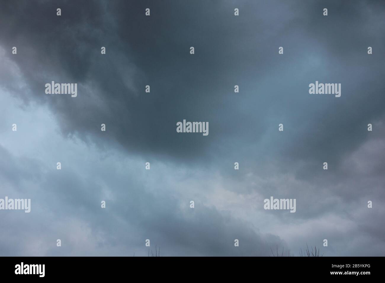 Blurred dramatic sky background. Exciting dark stormy clouds before rain Stock Photo