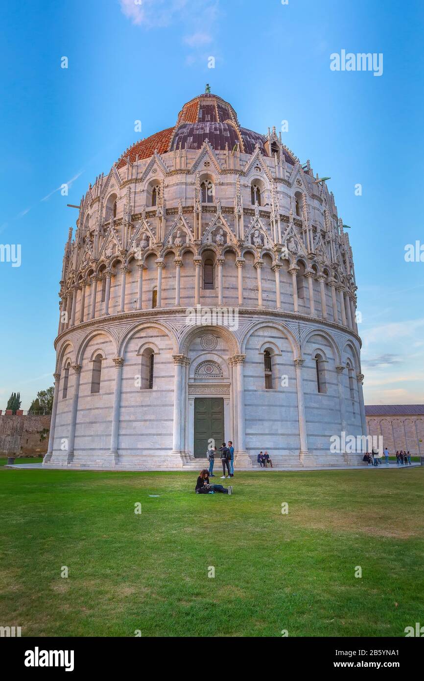 Pisa, Italy - October 25, 2018: Blue hour evening view of Baptistery, Cathedral on Square of Miracles Stock Photo