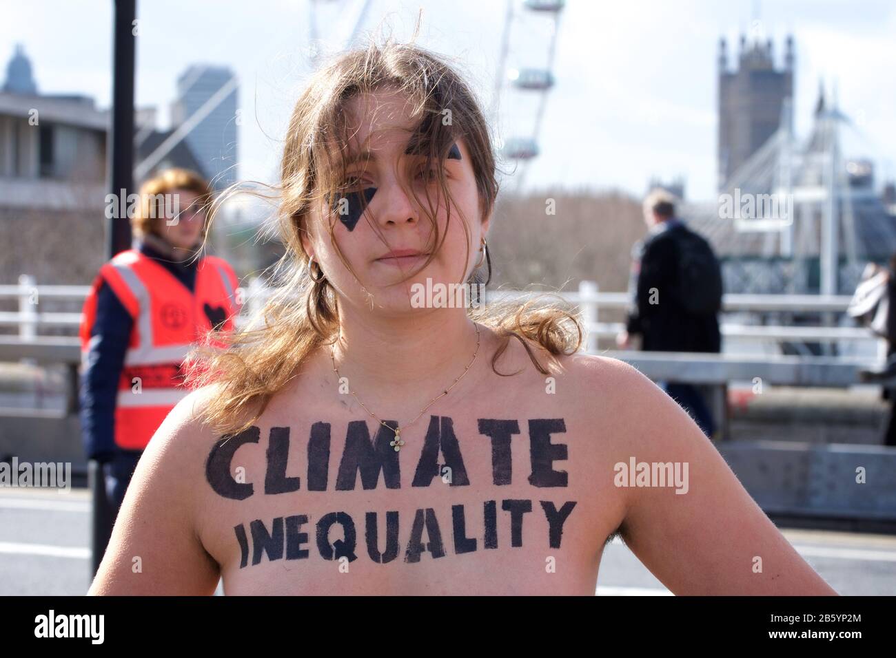 London, UK. 08th Mar, 2020. 08.03.20 - A group of 31 women formed a chain across Waterloo Bridge to "highlight the disproportionate impact of the climate and ecological emergency on women" Credit: Gareth Morris/Alamy Live News Stock Photo