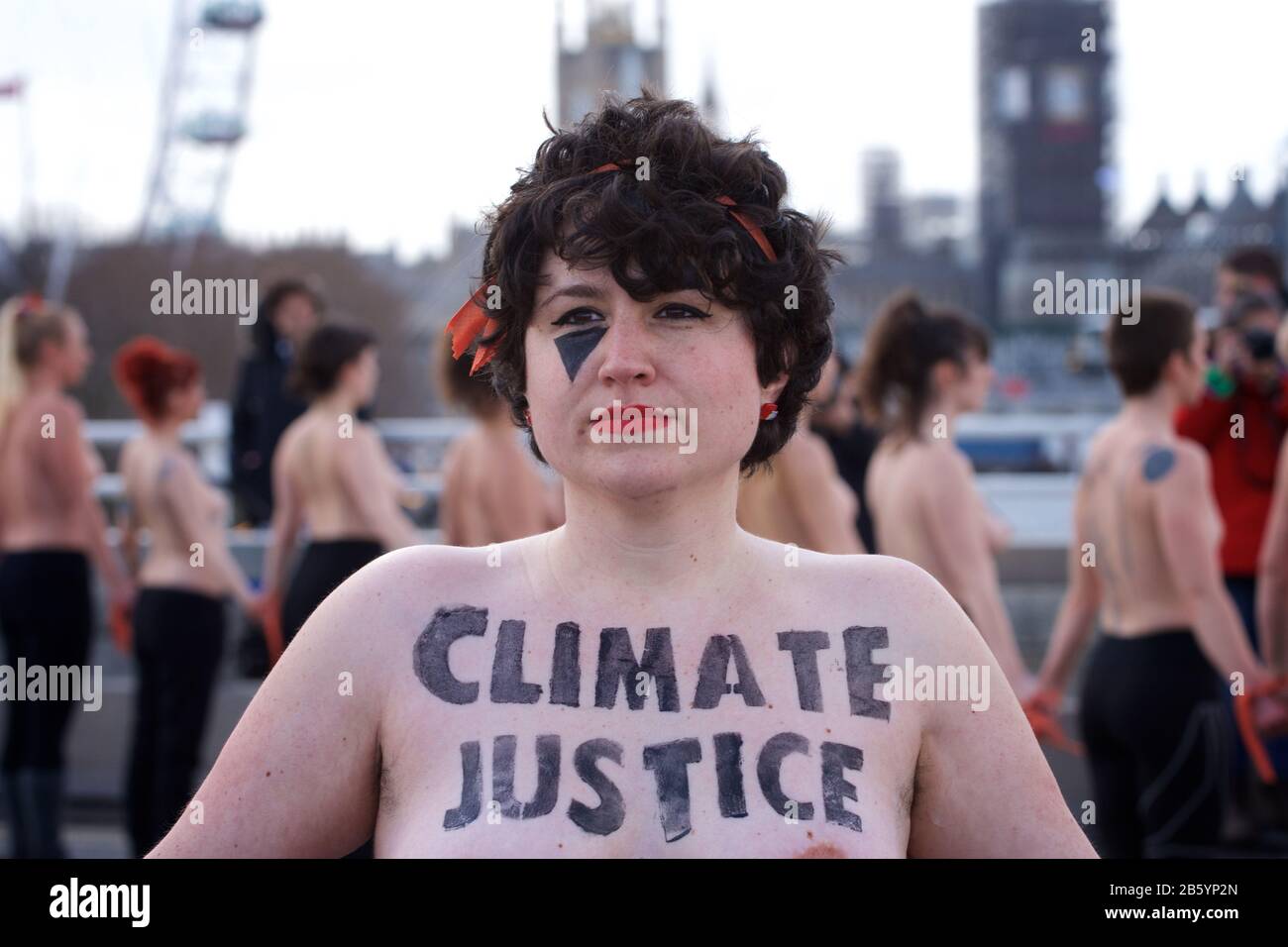 London, UK. 08th Mar, 2020. 08.03.20 - A group of 31 women formed a chain across Waterloo Bridge to "highlight the disproportionate impact of the climate and ecological emergency on women" Credit: Gareth Morris/Alamy Live News Stock Photo