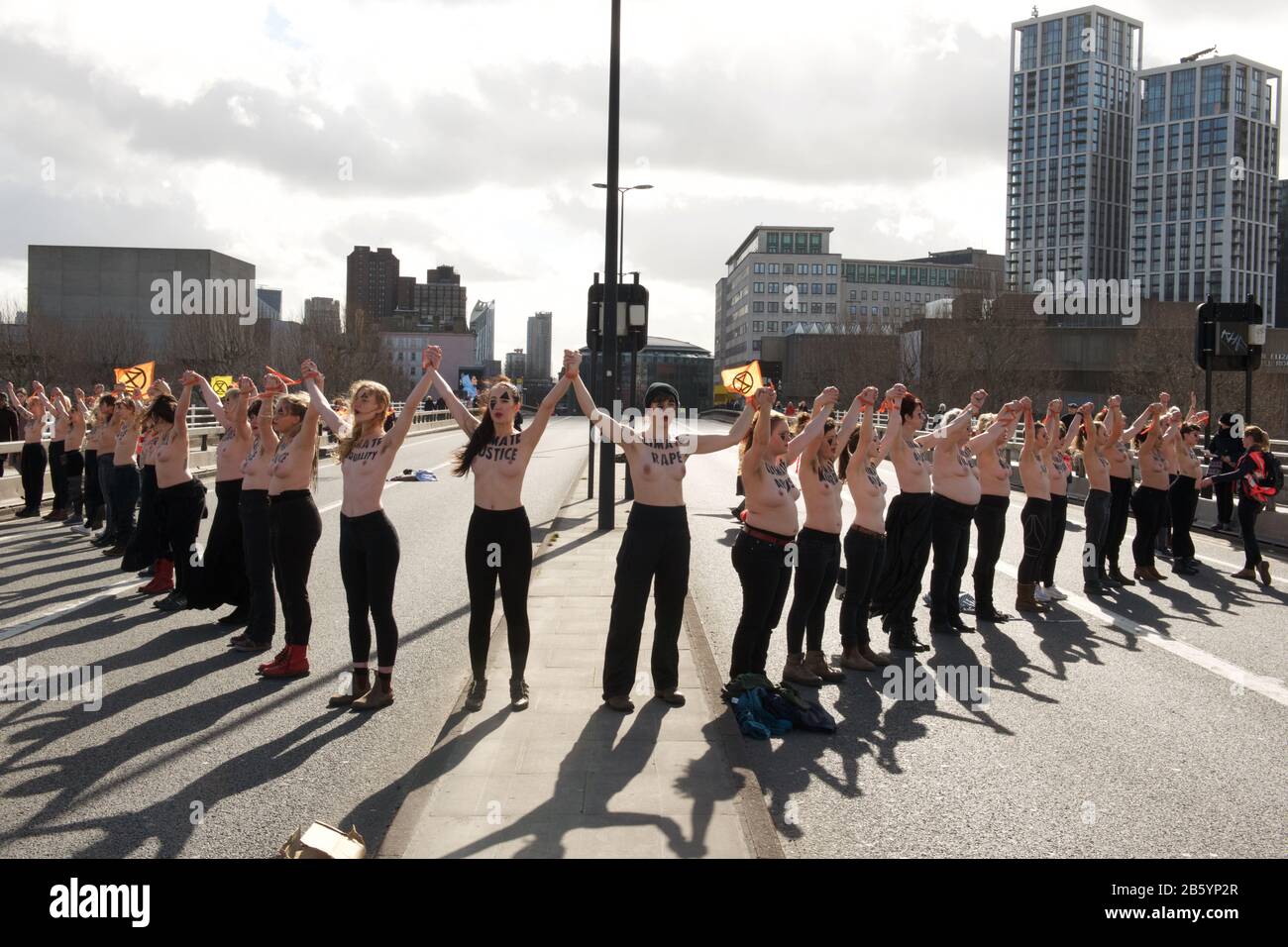 London, UK. 08th Mar, 2020. 08.03.20 - A group of 31 women formed a chain across Waterloo Bridge to "highlight the disproportionate impact of the climate and ecological emergency on women" Credit: Gareth Morris/Alamy Live News Stock Photo