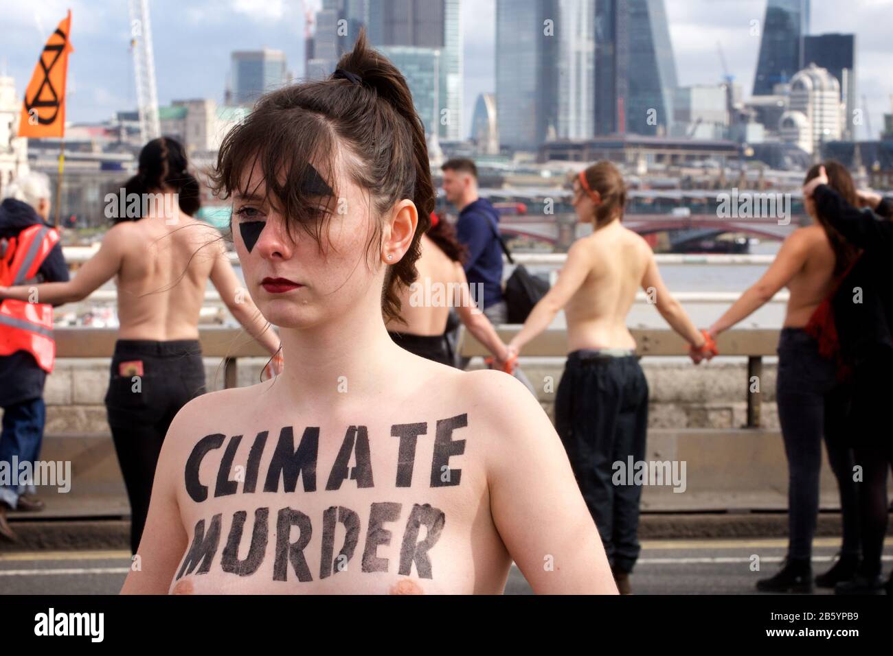 London, UK. 08th Mar, 2020. 08.03.20 - A group of 31 women formed a chain across Waterloo Bridge to "highlight the disproportionate impact of the climate and ecological emergency on women" Credit: Gareth Morris/Alamy Live News Stock Photo