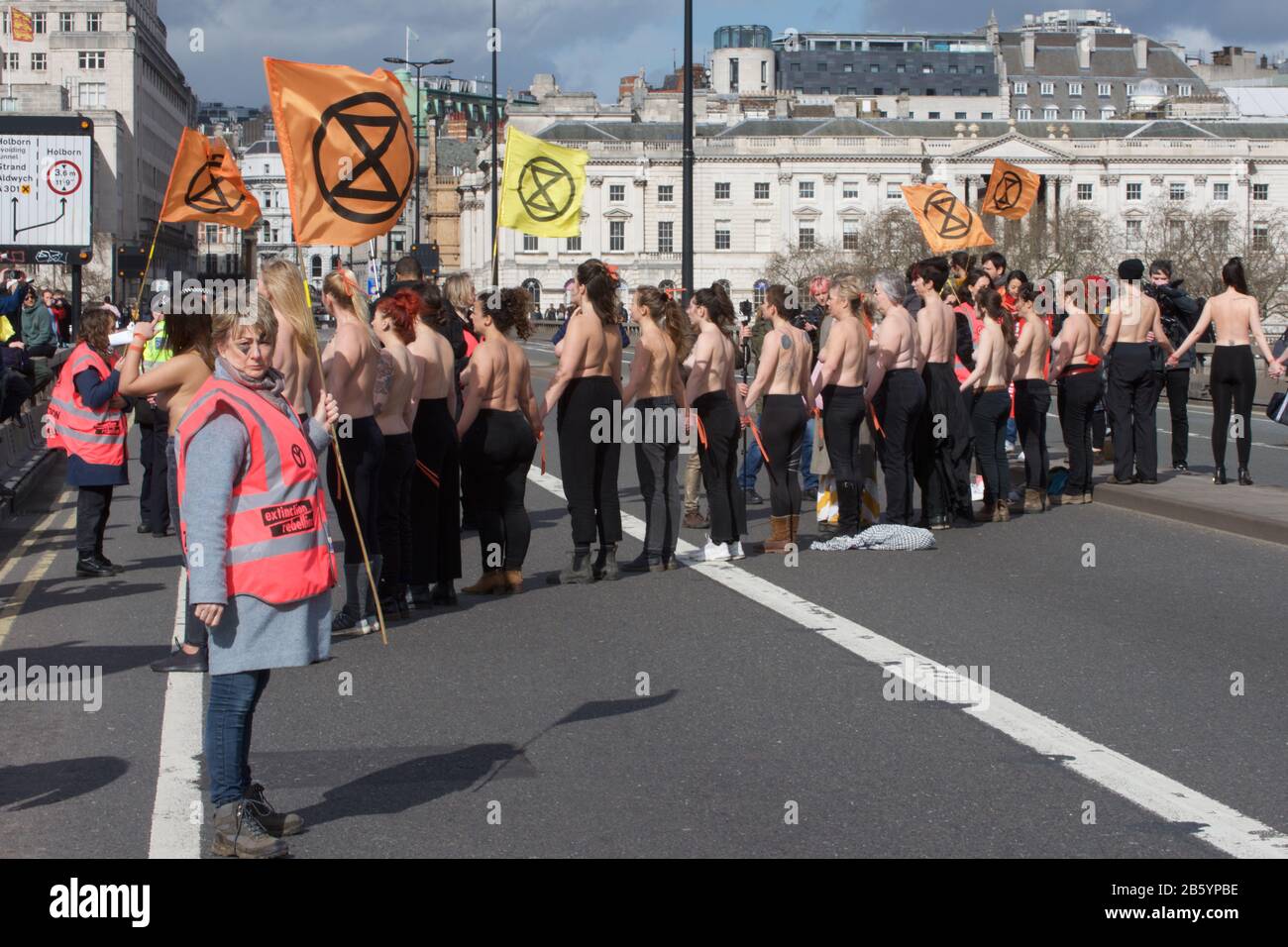 London, UK. 08th Mar, 2020. 08.03.20 - A group of 31 women formed a chain across Waterloo Bridge to "highlight the disproportionate impact of the climate and ecological emergency on women" Credit: Gareth Morris/Alamy Live News Stock Photo