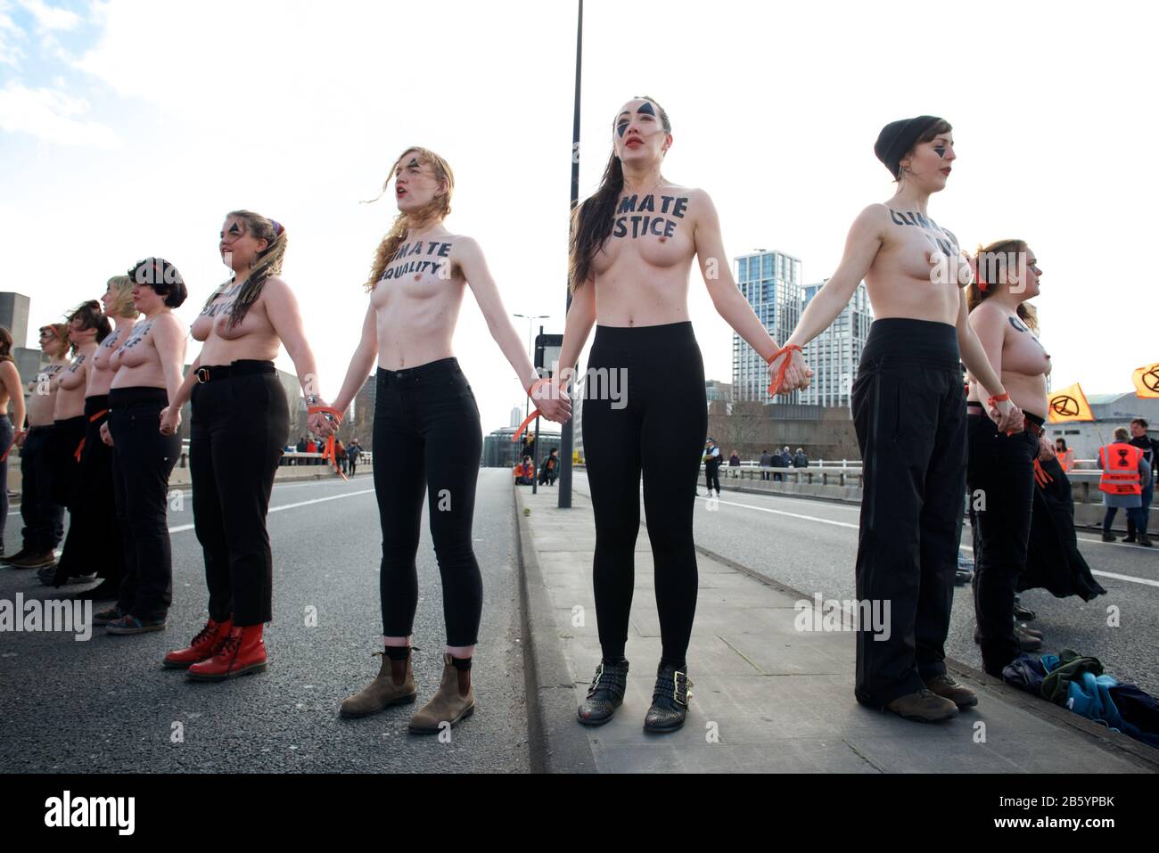 London, UK. 08th Mar, 2020. 08.03.20 - A group of 31 women formed a chain across Waterloo Bridge to "highlight the disproportionate impact of the climate and ecological emergency on women" Credit: Gareth Morris/Alamy Live News Stock Photo