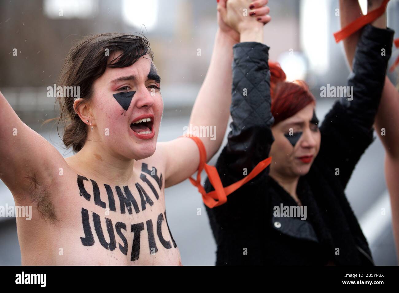 London, UK. 08th Mar, 2020. 08.03.20 - A group of 31 women formed a chain across Waterloo Bridge to "highlight the disproportionate impact of the climate and ecological emergency on women" Credit: Gareth Morris/Alamy Live News Stock Photo
