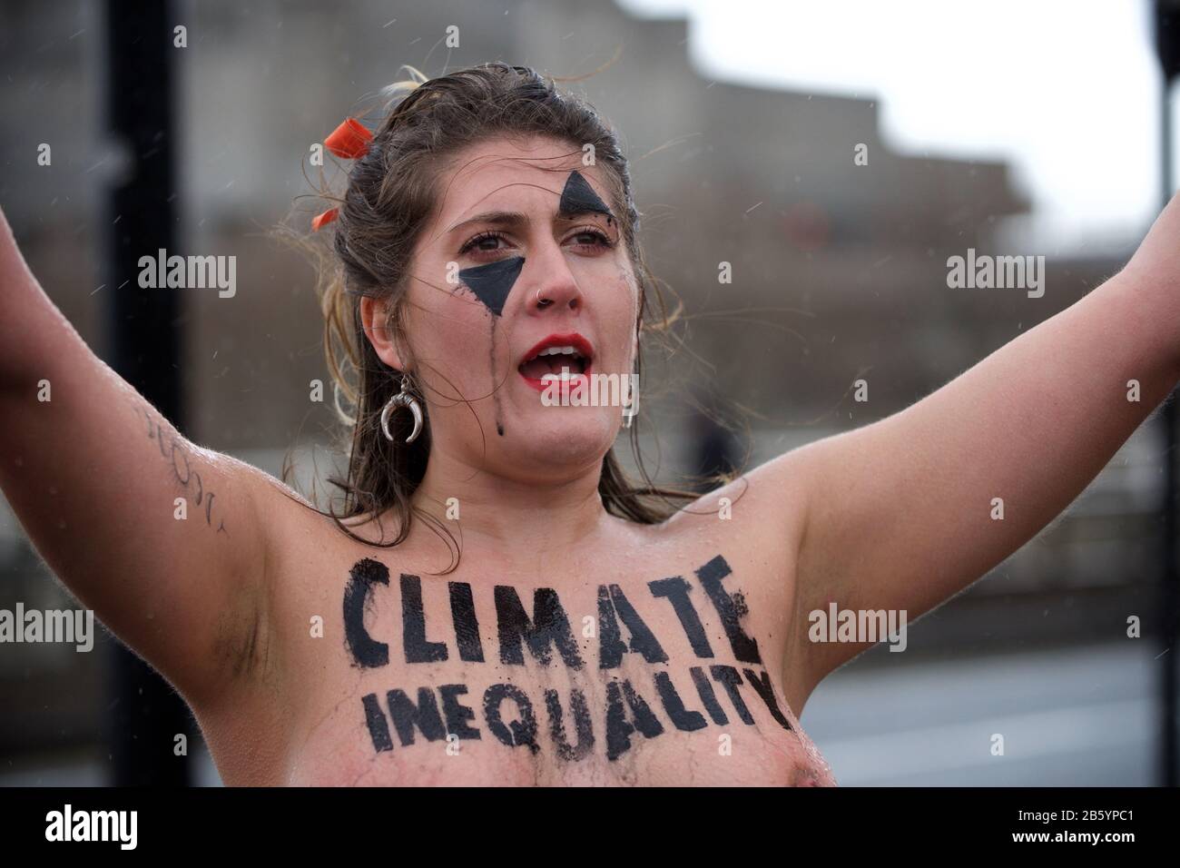 London, UK. 08th Mar, 2020. 08.03.20 - A group of 31 women formed a chain across Waterloo Bridge to "highlight the disproportionate impact of the climate and ecological emergency on women" Credit: Gareth Morris/Alamy Live News Stock Photo