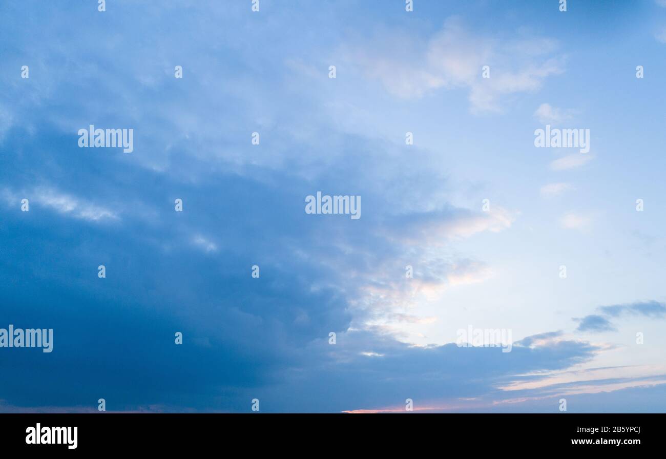 Evening blue sky with moderate clouds Stock Photo - Alamy